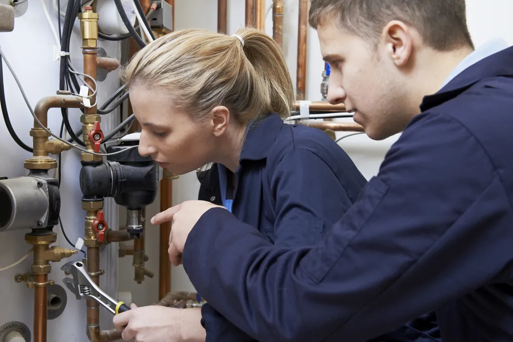 Gas Safe registered SD Plumbing & Heating engineers fitting a new boiler in Edinburgh