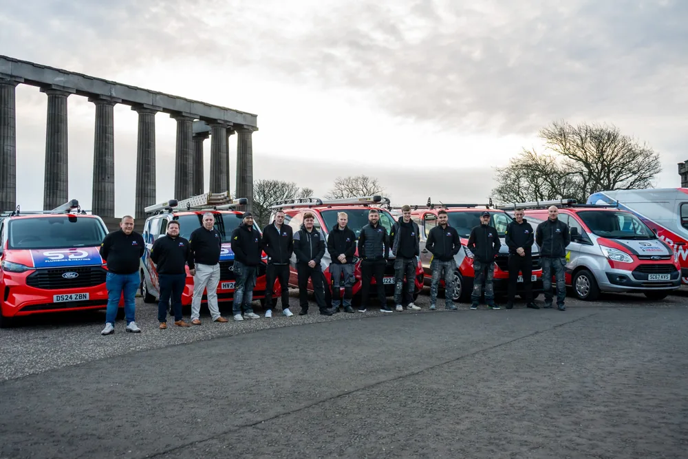 The SD Plumbing & Heating team with their van fleet in Edinburgh